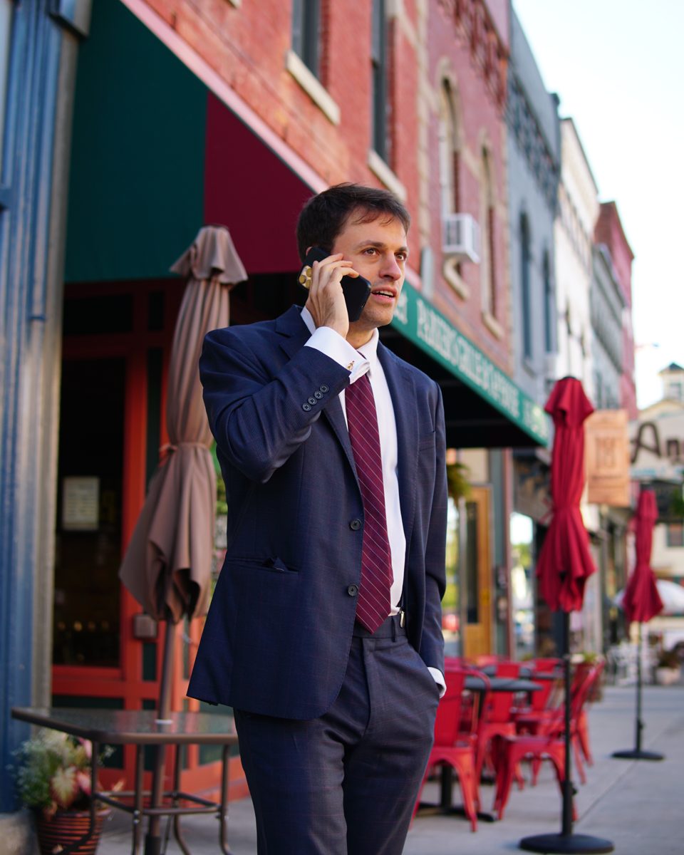 Thomas Plan on the phone on Main Street, Penn Yan.
